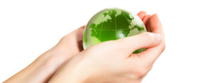 Holding green Earth in hand